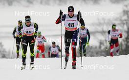 25.01.2015, Rybinsk, Russia (RUS): (l-r) Ivan Boiteux Perillat (FRA), One Way and Erik Bjornsen (USA), Rossignol, Swix - FIS world cup cross-country, skiathlon men, Rybinsk (RUS). www.nordicfocus.com. © Laiho/NordicFocus. Every downloaded picture is fee-liable.