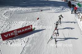 31.01.2015, Val di Fiemme, Italy (ITA): Skiers passing near Viessmann FIS Sponsor - FIS world cup nordic combined, team sprint HS134/2x7.5km, Val di Fiemme (ITA). www.nordicfocus.com. © Modica/NordicFocus. Every downloaded picture is fee-liable.
