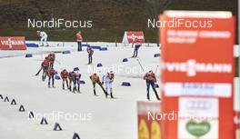 19.12.2015, Ramsau, Austria (AUT): a group of athletes passing the stadium   - FIS world cup nordic combined, individual gundersen HS96/10km, Ramsau (AUT). www.nordicfocus.com. © Felgenhauer/NordicFocus. Every downloaded picture is fee-liable.