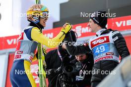 04.01.2015, Innsbruck, Austria (AUT): (l-r) Noriaki Kasai (JPN), Fischer and Simon Ammann (SUI), Fischer - FIS world cup ski jumping, four hills tournament, individual HS130, Innsbruck (AUT). www.nordicfocus.com. © Laiho/NordicFocus. Every downloaded picture is fee-liable.