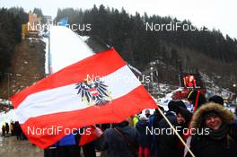 11.01.2015, Bad Mitterndorf, Austria (AUT): A spectator waves an austrian flag before the competition - FIS world cup ski jumping, individual HS200, Bad Mitterndorf (AUT). www.nordicfocus.com. © Domanski/NordicFocus. Every downloaded picture is fee-liable.