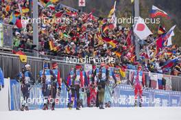09.01.2016, Ruhpolding, Germany (GER): Event Feature: Athletes walk to the startline infront of the fans with waving flags -  IBU world cup biathlon, pursuit men, Ruhpolding replacing Oberhof (GER). www.nordicfocus.com. © Manzoni/NordicFocus. Every downloaded picture is fee-liable.