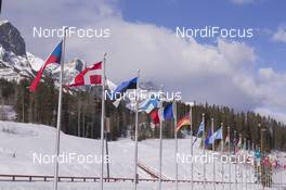 02.02.2016, Canmore, Canada (CAN): Event Feature: Stadium overview with flags and Rocky Mountains -  IBU world cup biathlon, training, Canmore (CAN). www.nordicfocus.com. © Manzoni/NordicFocus. Every downloaded picture is fee-liable.