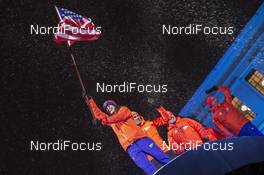 02.03.2016, Oslo, Norway (NOR): Clare Egan (USA) waves the US flag while the team walks in - IBU world championships biathlon, opening ceremony, Oslo (NOR). www.nordicfocus.com. © NordicFocus. Every downloaded picture is fee-liable.