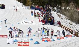 12.03.2016, Canmore, Canada (CAN): the chasing group passes the stadium   - FIS world cup cross-country, pursuit women, Canmore (CAN). www.nordicfocus.com. © Felgenhauer/NordicFocus. Every downloaded picture is fee-liable.