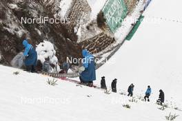 28.02.2016, Val di Fiemme, Italy (ITA): Volunteers preparing the ski jumping hill of Predazzo   - FIS world cup nordic combined, individual gundersen HS134/10km, Val di Fiemme (ITA). www.nordicfocus.com. © Modica/NordicFocus. Every downloaded picture is fee-liable.