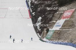 28.02.2016, Val di Fiemme, Italy (ITA): Volunteers preparing the ski jumping hill of Predazzo   - FIS world cup nordic combined, individual gundersen HS134/10km, Val di Fiemme (ITA). www.nordicfocus.com. © Modica/NordicFocus. Every downloaded picture is fee-liable.