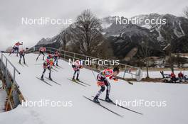 18.12.2016, Ramsau, Austria (AUT): Group of athletes with Dachstein Mountains   - FIS world cup nordic combined, individual gundersen HS96/10km, Ramsau (AUT). www.nordicfocus.com. © Rauschendorfer/NordicFocus. Every downloaded picture is fee-liable.