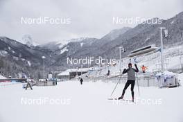 15.01.2019, Ruhpolding, Germany (GER): Event Feature: undefined skier competes on the track while volunteers prepare the venue for the world cup -  IBU world cup biathlon, training, Ruhpolding (GER). www.nordicfocus.com. © Manzoni/NordicFocus. Every downloaded picture is fee-liable.