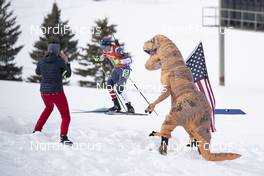 17.02.2019, Soldier Hollow, United States of America (USA): Jake Brown (USA) cheered by an american dinosaur -  IBU world cup biathlon, relay mixed, Soldier Hollow (USA). www.nordicfocus.com. © Manzoni/NordicFocus. Every downloaded picture is fee-liable.