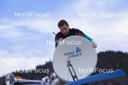 18.12.2019, Annecy-Le Grand Bornand, France (FRA): Event Feature: French technician fixes the satellite dish -  IBU world cup biathlon, training, Annecy-Le Grand Bornand (FRA). www.nordicfocus.com. © Manzoni/NordicFocus. Every downloaded picture is fee-liable.