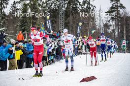 27.01.2019, Ulricehamn, Sweden (SWE): Andrey Larkov (RUS), Calle Halfvarsson (SWE), Evgeniy Belov (RUS), (l-r)  - FIS world cup cross-country, 4x10km men, Ulricehamn (SWE). www.nordicfocus.com. © Modica/NordicFocus. Every downloaded picture is fee-liable.