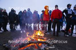03.03.2019, Mora, Sweden (SWE): Event Feature: undefined athletes get some heat at a bonfire - Visma Ski Classics and FIS Marathon Cup Vasaloppet, Mora (SWE). www.nordicfocus.com. © Manzoni/NordicFocus. Every downloaded picture is fee-liable.