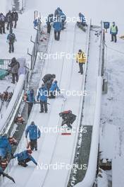 28.12.2020, Oberstdorf, Germany (GER): Event Feature: volunteer clean the inrun - FIS world cup ski jumping men, four hills tournament, qualification, individual HS137, Oberstdorf (GER). www.nordicfocus.com. © EXPA/JFK/NordicFocus. Every downloaded picture is fee-liable.