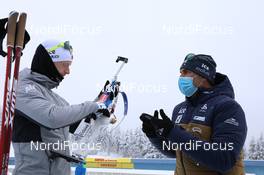 15.01.2021, Oberhof, Germany (GER): Johannes Thingnes Boe (NOR), Siegfried Mazet (FRA) coach team Norway, (l-r) -  IBU World Cup Biathlon, relay men, Oberhof (GER). www.nordicfocus.com. © Manzoni/NordicFocus. Every downloaded picture is fee-liable.