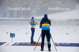 22.01.2021, Antholz, Italy (ITA): Martin Ponsiluoma (SWE), Jean Marc Chabloz (SUI), coach Team Sweden, (l-r) -  IBU World Cup Biathlon, individual men, Antholz (ITA). www.nordicfocus.com. © Manzoni/NordicFocus. Every downloaded picture is fee-liable.