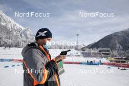 24.01.2021, Antholz, Italy (ITA): Event Feature: Siwidata technician Kruno shows the start gun -  IBU World Cup Biathlon, relay women, Antholz (ITA). www.nordicfocus.com. © Manzoni/NordicFocus. Every downloaded picture is fee-liable.
