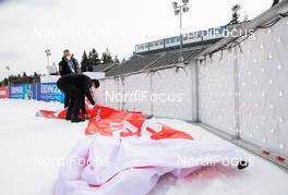 10.03.2021, Nove Mesto, Czech Republic (CZE): Event Feature: APA-technicians install the Viessmann banners - IBU World Cup Biathlon, training, Nove Mesto (CZE). www.nordicfocus.com. © Manzoni/NordicFocus. Every downloaded picture is fee-liable.