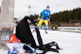 10.03.2021, Nove Mesto, Czech Republic (CZE): Event Feature: a drinking belt lies on the snow at the shooting range while athletes compete - IBU World Cup Biathlon, training, Nove Mesto (CZE). www.nordicfocus.com. © Manzoni/NordicFocus. Every downloaded picture is fee-liable.