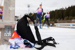 10.03.2021, Nove Mesto, Czech Republic (CZE): Event Feature: a drinking belt lies on the snow at the shooting range while athletes compete - IBU World Cup Biathlon, training, Nove Mesto (CZE). www.nordicfocus.com. © Manzoni/NordicFocus. Every downloaded picture is fee-liable.