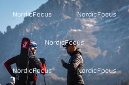 09.10.2021, Lavaze, Italy (ITA): Johannes Thingnes Boe (NOR), Siegfried Mazet (FRA) coach team Norway, (l-r) - Biathlon training, Lavaze (ITA). www.nordicfocus.com. © Vanzetta/NordicFocus. Every downloaded picture is fee-liable.