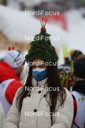 10.02.2021, Pokljuka, Slovenia (SLO): Event Feature: ceremony girl with funny hat - IBU World Championships Biathlon, relay mixed, Pokljuka (SLO). www.nordicfocus.com. © Manzoni/NordicFocus. Every downloaded picture is fee-liable.