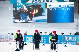 20.02.2021, Pokljuka, Slovenia (SLO): Vetle Sjaastad Christiansen (NOR) competes on the screen while the volunteers wait for athletes in the penalty loop - IBU World Championships Biathlon, relay men, Pokljuka (SLO). www.nordicfocus.com. © Manzoni/NordicFocus. Every downloaded picture is fee-liable.