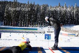 15.02.2021, Pokljuka, Slovenia (SLO): Johannes Thingnes Boe (NOR), Siegfried Mazet (FRA) coach team Norway, (l-r) - IBU World Championships Biathlon, training, Pokljuka (SLO). www.nordicfocus.com. © Manzoni/NordicFocus. Every downloaded picture is fee-liable.