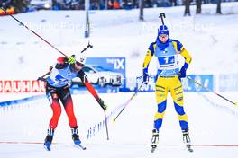 05.12.2021, Oestersund, Sweden, (SWE): Marte Olsbu Roeiseland (NOR), Hanna Oeberg (SWE), (l-r) - IBU World Cup Biathlon, relay women, Oestersund (SWE). www.nordicfocus.com. © Manzoni/NordicFocus. Every downloaded picture is fee-liable.