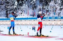 19.12.2021, Annecy-Le Grand Bornand, France (FRA): Quentin Fillon Maillet (FRA), Felix Leitner (AUT), (l-r) -  IBU World Cup Biathlon, mass men, Annecy-Le Grand Bornand (FRA). www.nordicfocus.com. © Manzoni/NordicFocus. Every downloaded picture is fee-liable.