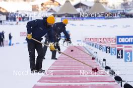 18.12.2021, Annecy-Le Grand Bornand, France (FRA): Event Feature: Volunteers clean the shooting range -  IBU World Cup Biathlon, pursuit women, Annecy-Le Grand Bornand (FRA). www.nordicfocus.com. © Manzoni/NordicFocus. Every downloaded picture is fee-liable.