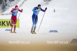 02.01.2021 Val Mustair, Switzerland (SUI): Evgeniy Belov (RUS), Dario Cologna (SUI), (l-r)  - FIS world cup cross-country, tour de ski, mass men, Val Mustair (SUI). www.nordicfocus.com. © Modica/NordicFocus. Every downloaded picture is fee-liable.