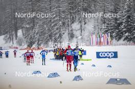 02.01.2021 Val Mustair, Switzerland (SUI): Evgeniy Belov (RUS), Dario Cologna (SUI), (l-r)  - FIS world cup cross-country, tour de ski, mass men, Val Mustair (SUI). www.nordicfocus.com. © Modica/NordicFocus. Every downloaded picture is fee-liable.