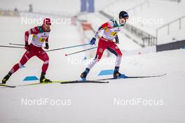 24.01.2021, Lahti Finland (FIN): Andrey Melnichenko (RUS), Sjur Roethe (NOR), (l-r)  - FIS world cup cross-country, 4x10km men, Lahti (FIN). www.nordicfocus.com. © Modica/NordicFocus. Every downloaded picture is fee-liable.