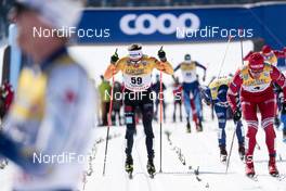 13.03.2021, Engadin, Switzerland (SUI): Sebastian Eisenlauer (GER), Evgeniy Belov (RUS), (l-r)  - FIS world cup cross-country, mass men, Engadin (SUI). www.nordicfocus.com. © Modica/NordicFocus. Every downloaded picture is fee-liable.