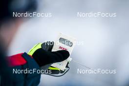 28.11.2021, Ruka, Finland (FIN): Pierre Mignerey measuring the temperature that was around -22   - FIS world cup cross-country, pursuit women, Ruka (FIN). www.nordicfocus.com. © Modica/NordicFocus. Every downloaded picture is fee-liable.