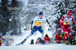 05.12.2021, Lillehammer, Norway (NOR): Remi Lindholm (FIN), Denis Spitsov (RUS), (l-r)  - FIS world cup cross-country, 4x7.5km men, Lillehammer (NOR). www.nordicfocus.com. © Modica/NordicFocus. Every downloaded picture is fee-liable.