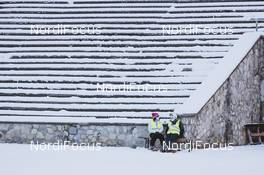 31.12.2020, Garmisch, Germany (GER): Event Feature: volunteers rest below the empty grand stands - FIS world cup ski jumping men, four hills tournament, qualification, individual HS142, Garmisch (GER). www.nordicfocus.com. © EXPA/JFK/NordicFocus. Every downloaded picture is fee-liable.