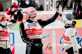 28.02.2021, Oberstdorf, Germany (GER): Katharina Althaus (GER), Karl Geiger (GER), Anna Rupprecht (GER), (l-r)  - FIS nordic world ski championships ski jumping men, mixed team HS106, Oberstdorf (GER). www.nordicfocus.com. © Modica/NordicFocus. Every downloaded picture is fee-liable.