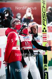 28.02.2021, Oberstdorf, Germany (GER): Michael Hayboeck (AUT), Stefan Kraft (AUT), (l-r), Marita Kramer (AUT), (l-r)  - FIS nordic world ski championships ski jumping men, mixed team HS106, Oberstdorf (GER). www.nordicfocus.com. © Modica/NordicFocus. Every downloaded picture is fee-liable.