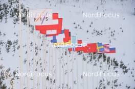 26.03.2021, Chaikovsky, Russia (RUS): Feature: FIS and nations flags in the wind - FIS world cup ski jumping women, individual HS102, Chaikovsky (RUS). www.nordicfocus.com. © Tumashov/NordicFocus. Every downloaded picture is fee-liable.