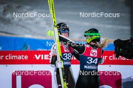 04.12.2021 Lillehammer, Norway (NOR): Ursa Bogataj (SLO), Nika Kriznar (SLO), (l-r)  - FIS world cup ski jumping women, individual HS98, Lillehammer (NOR). www.nordicfocus.com. © Modica/NordicFocus. Every downloaded picture is fee-liable.