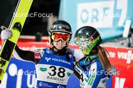 17.12.2021, Ramsau, Austria, (AUT): Ursa Bogataj (SLO), Nika Kriznar (SLO), (l-r)  - FIS world cup ski jumping women, individual HS98, Ramsau (AUT). www.nordicfocus.com. © Volk/NordicFocus. Every downloaded picture is fee-liable.