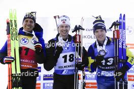 18.03.2022, Oslo, Norway (NOR): Quentin Fillon Maillet (FRA), Sturla Holm Laegreid (NOR), Sebastian Samuelsson (SWE), (l-r) - IBU World Cup Biathlon, sprint men, Oslo (NOR). www.nordicfocus.com. © Manzoni/NordicFocus. Every downloaded picture is fee-liable.