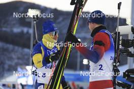 18.02.2022, Beijing, China (CHN): Martin Ponsiluoma (SWE), Johannes Thingnes Boe (NOR), (l-r) - XXIV. Olympic Winter Games Beijing 2022, Biathlon, mass men, Beijing (CHN). www.nordicfocus.com. © Manzoni/NordicFocus. Every downloaded picture is fee-liable.