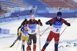 18.02.2022, Beijing, China (CHN): Christian Gow (CAN), Johannes Thingnes Boe (NOR), (l-r) - XXIV. Olympic Winter Games Beijing 2022, Biathlon, mass men, Beijing (CHN). www.nordicfocus.com. © Manzoni/NordicFocus. Every downloaded picture is fee-liable.
