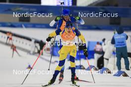 05.02.2022, Beijing, China (CHN): Martin Ponsiluoma (SWE), Emilien Jacquelin (FRA), (l-r) - XXIV. Olympic Winter Games Beijing 2022, Biathlon, mixed relay, Beijing (CHN). www.nordicfocus.com. © Manzoni/NordicFocus. Every downloaded picture is fee-liable.