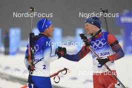 13.02.2022, Beijing, China (CHN): Quentin Fillon Maillet (FRA), Tarjei Boe (NOR), (l-r) - XXIV. Olympic Winter Games Beijing 2022, Biathlon, pursuit men, Beijing (CHN). www.nordicfocus.com. © Manzoni/NordicFocus. Every downloaded picture is fee-liable.