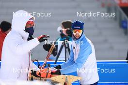 15.02.2022, Beijing, China (CHN): Siegfried Mazet (FRA) coach team Norway, Sturla Holm Laegreid (NOR), (l-r) - XXIV. Olympic Winter Games Beijing 2022, Biathlon, relay men, Beijing (CHN). www.nordicfocus.com. © Manzoni/NordicFocus. Every downloaded picture is fee-liable.