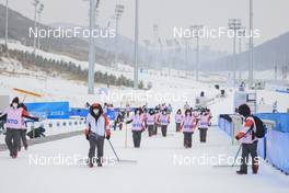 12.02.2022, Beijing, China (CHN): Event Feature: Volunteers prepare the stadium for the competition and remove the snow - XXIV. Olympic Winter Games Beijing 2022, Biathlon, training, Beijing (CHN). www.nordicfocus.com. © Manzoni/NordicFocus. Every downloaded picture is fee-liable.